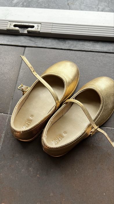 Golden shoes for a girl