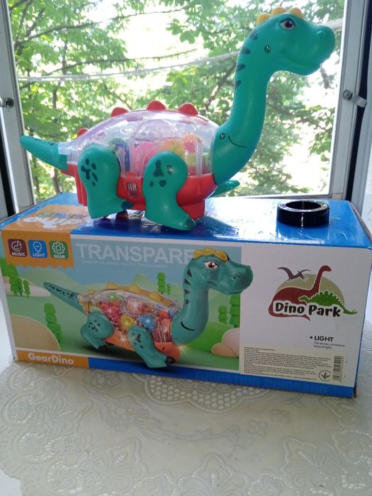 Динозавр,танцює,шестерні звук,світло 2 кольори