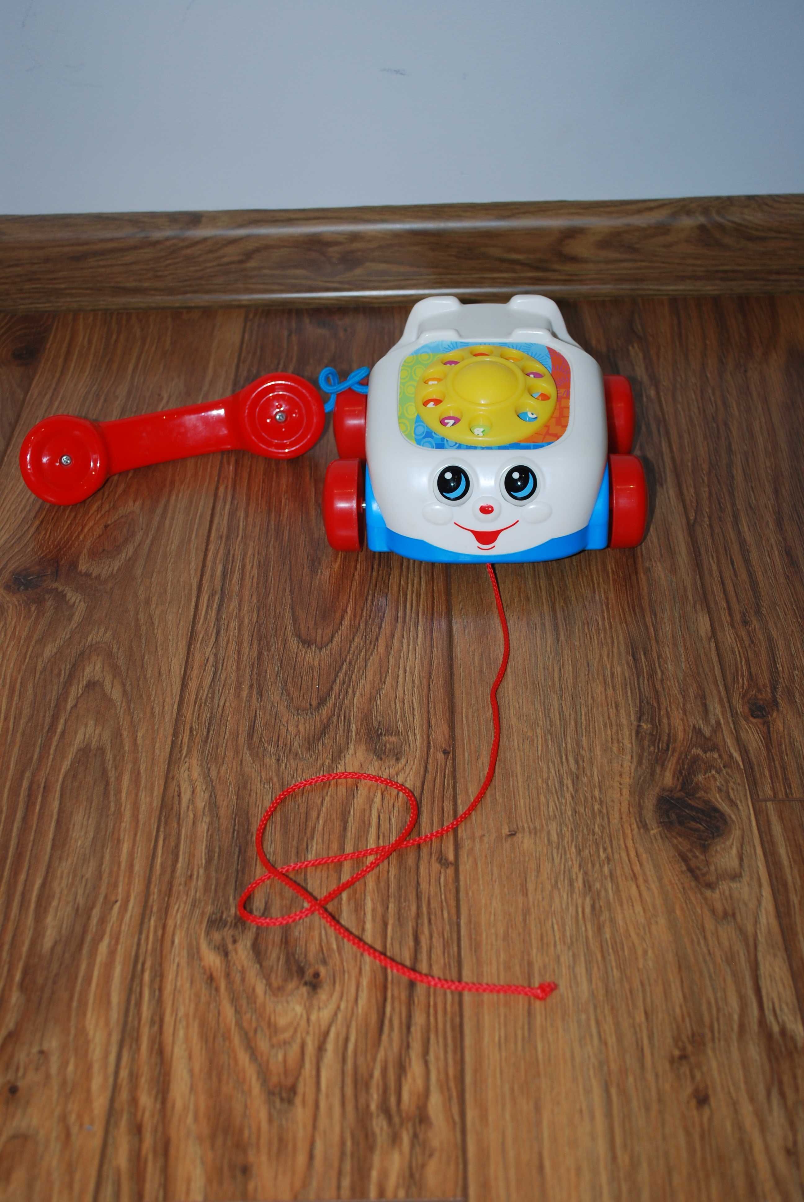 Fisher Price - jeżdżący telefon z oczkami