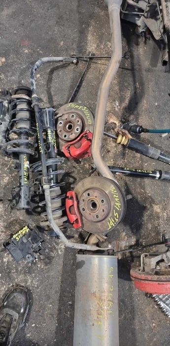 amortyzator sprężyna wahacz zacisk piasta belka Suzuki Swift III