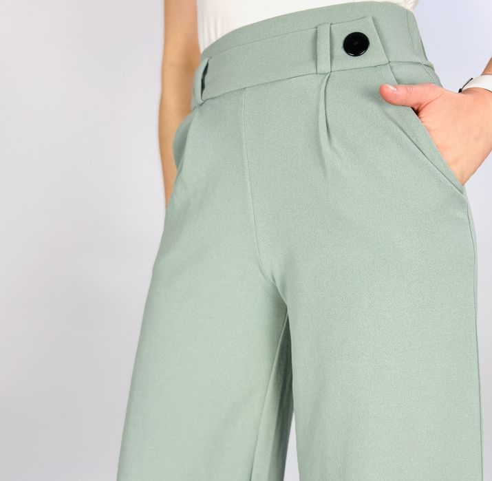 Miętowe spodnie z szeroką nogawką XS 34
