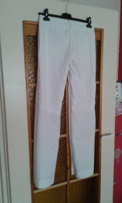 Spodnie białe rozszerzane dlugie materiałowe