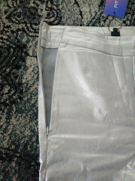 Nowe spodnie błyszczące legginsy