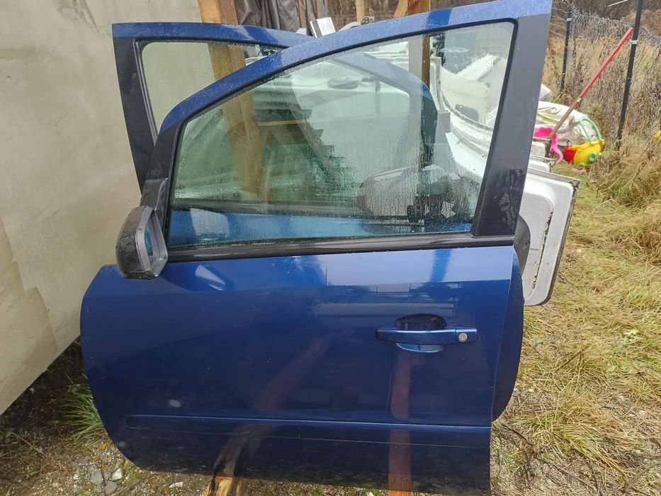DRZWI PRZEDNIE LEWE  NIEBIESKIE OPEL ZAFIRA B 2005R