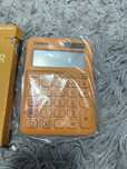 Casio kalkulator nowy pomaranczowy
