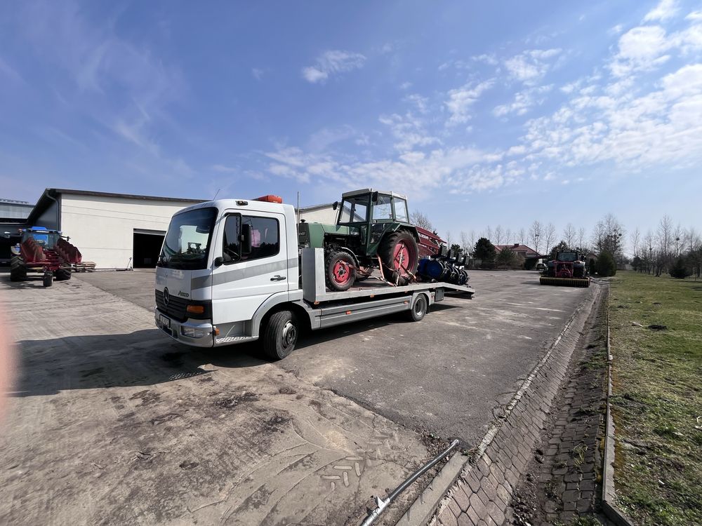 Pomoc drogowa. Autolaweta.Usługi transportowe.