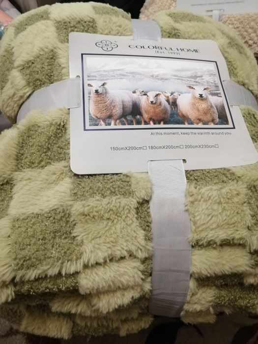 Теплі пледи на штучний овчині