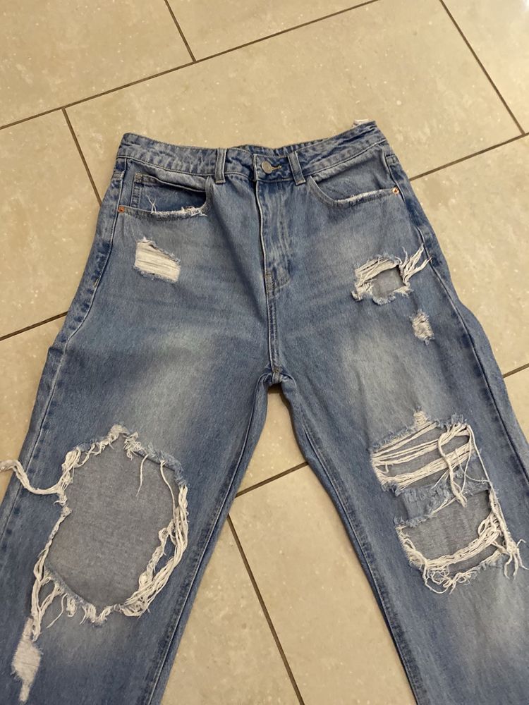 Damskie jeans, extra szerokie spodnie New Yorker  r. L/40 dziury