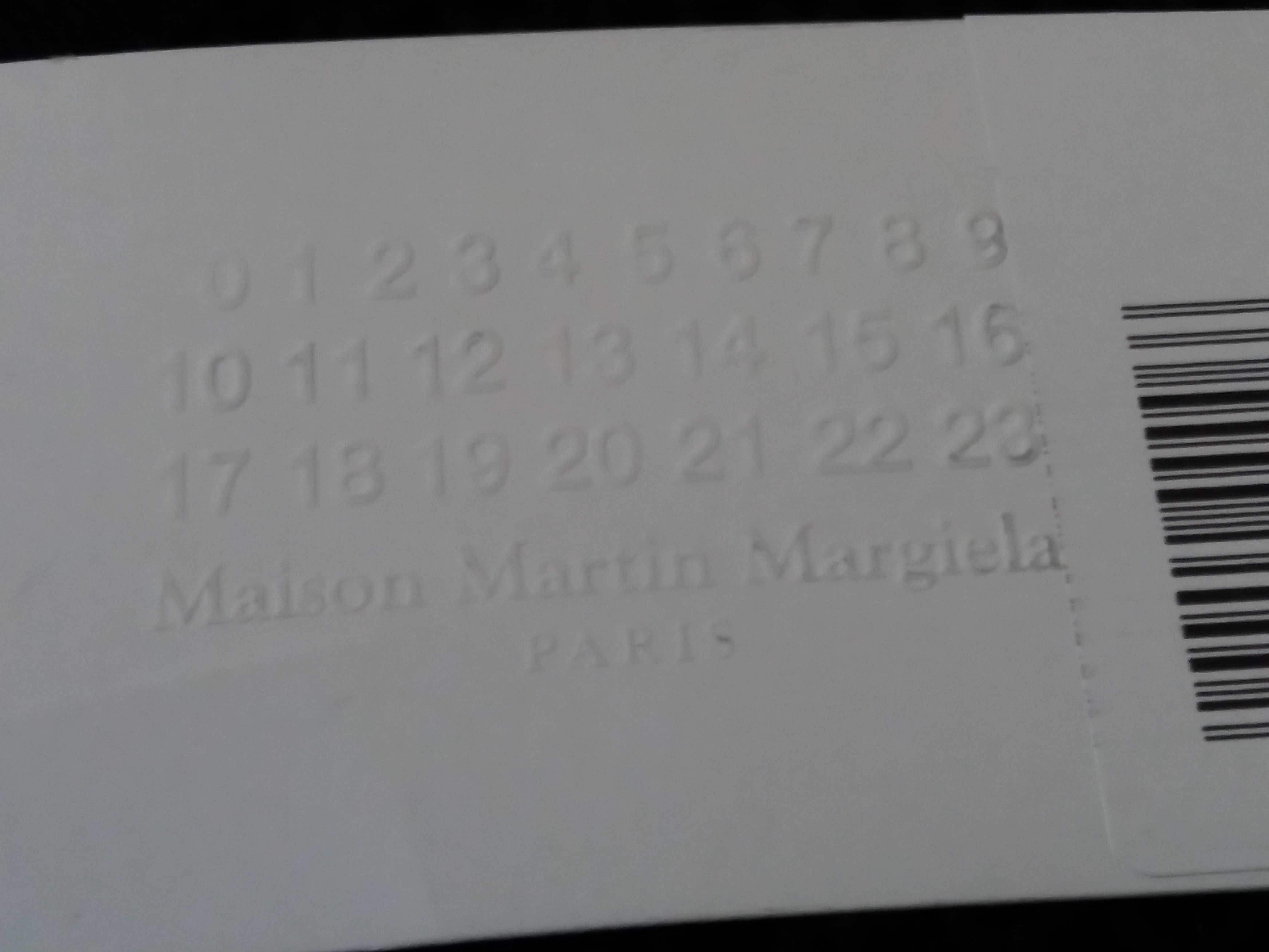 новый фишнет топ от Maison Martin Margiela