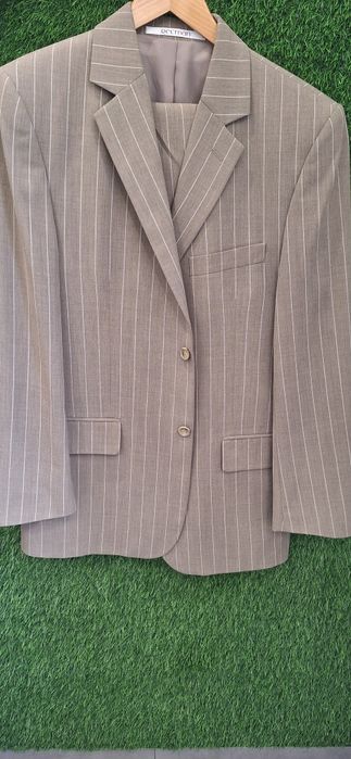 Nowy garnitur jasnobrązowy 176 cm