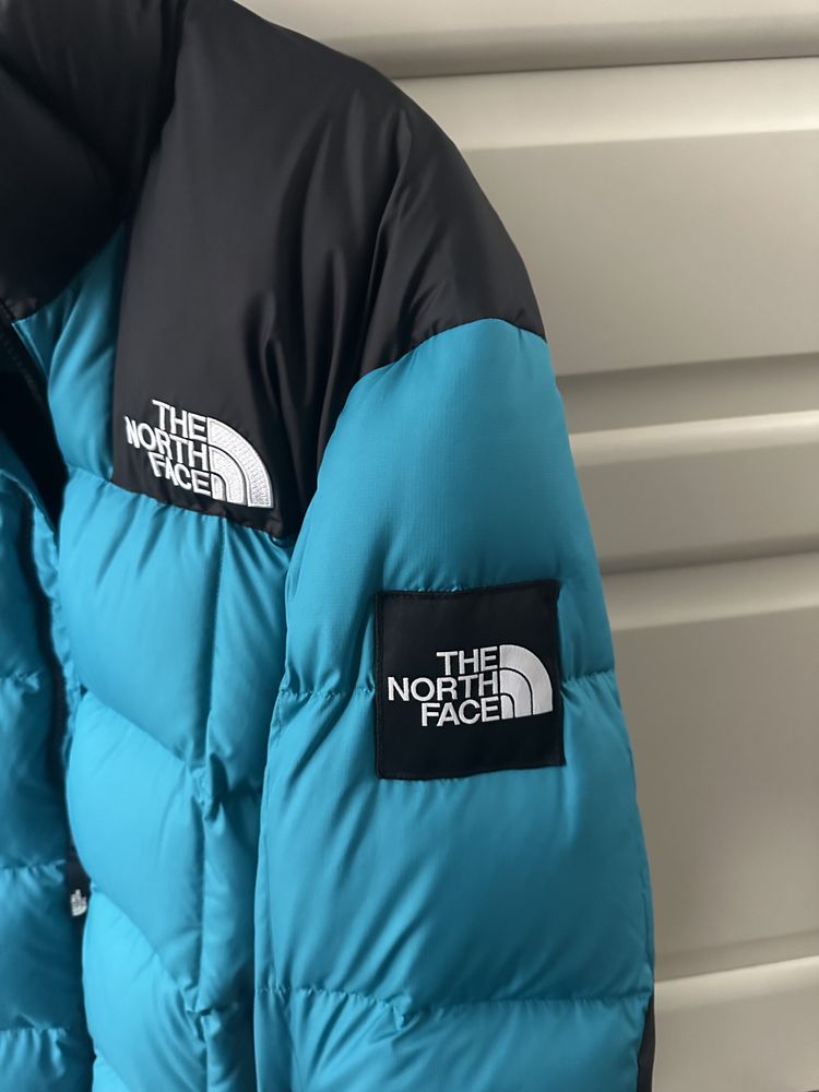 The North Face пуховик синий