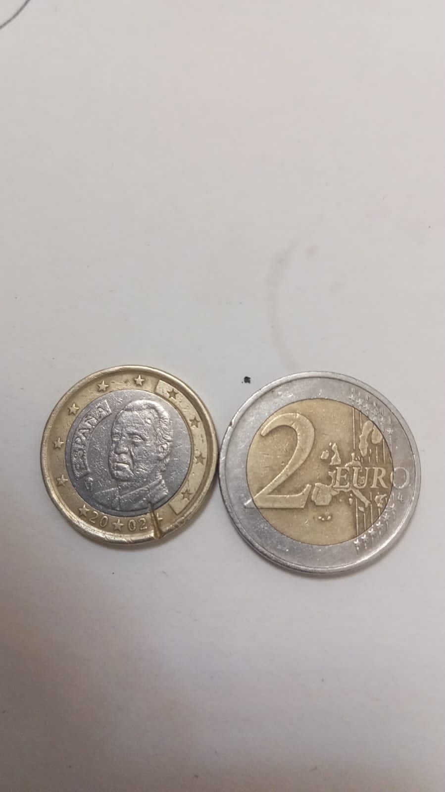 Монеты с одинаковым браком 1 и 2 евро