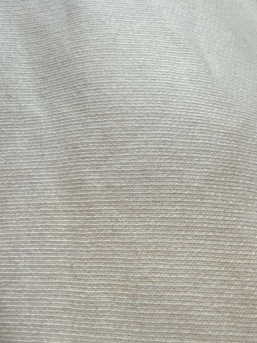 Біла трикотажна тканина