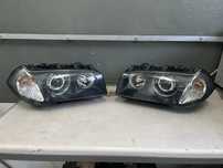 Bmw e83 X3 lampy bi led komplet reflektory bi led
