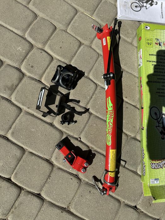 Trail-Gator drążek tandemowy, czerwony. Prowadnica do roweru Uchwyt