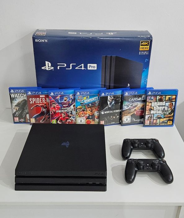 Ps4 Pro 1 TB +2 pady okablowanie i 4 gry