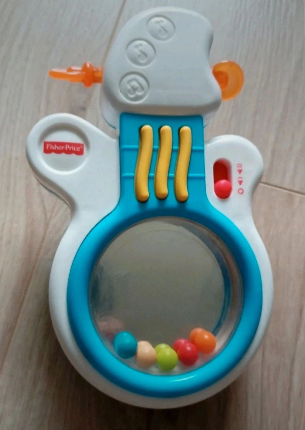 Fisher Price gitara grająca melodie grzechotka wańka wstańka z lusterk