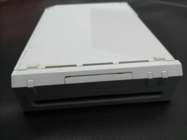 Consola WI da Nintendo, com transformador e base.