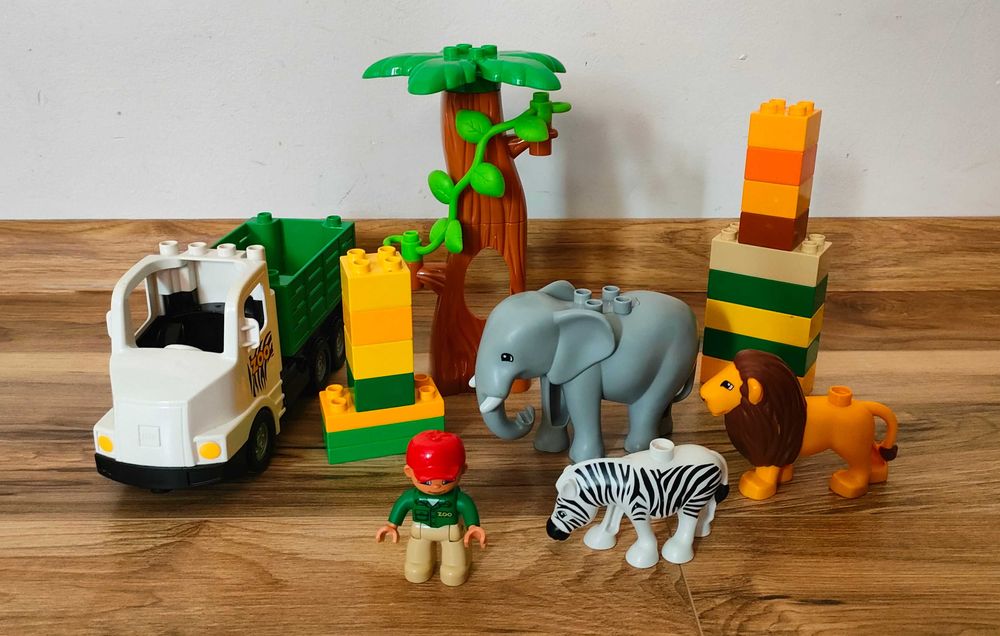 Lego DUPLO zoo safari ciężarówka dinozaury lew drzewo