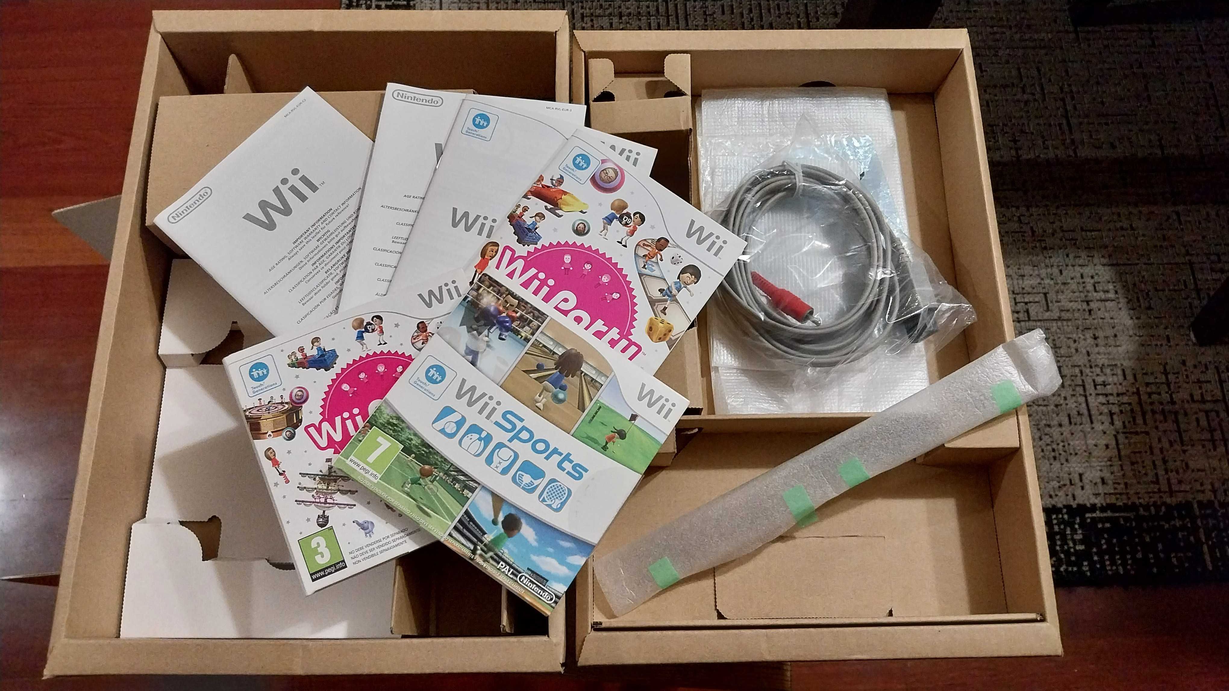 Caixa Nintendo Wii Family  com acessórios e dois jogos