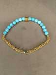 Pulseira em prata dourada e turquesas