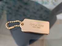 Золотий брелок до сумочки Coach New York
