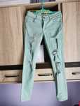 jeansy jasnozielone z dziurami guess 38