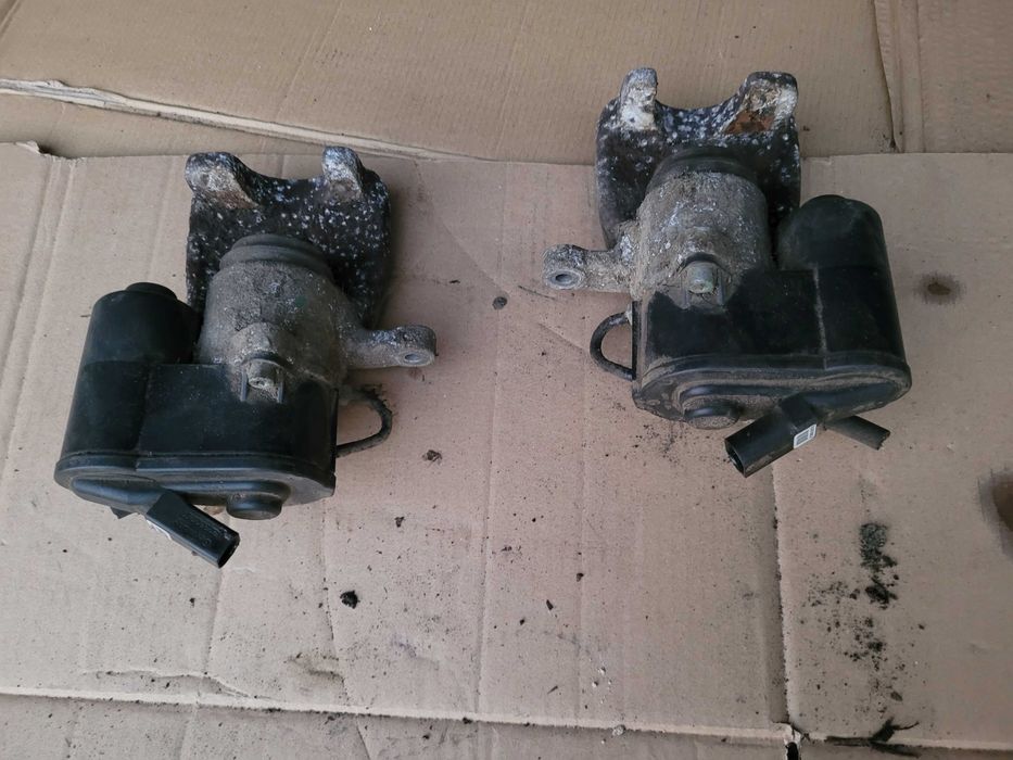 Zacisk hamulcowy elektryczny prawy tył tylny PASSAT B6 B7