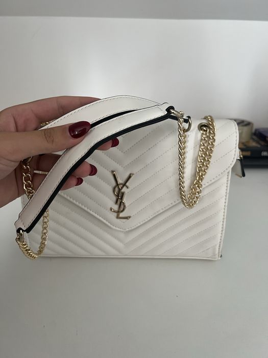 Mala ysl branca com detalhes dourados