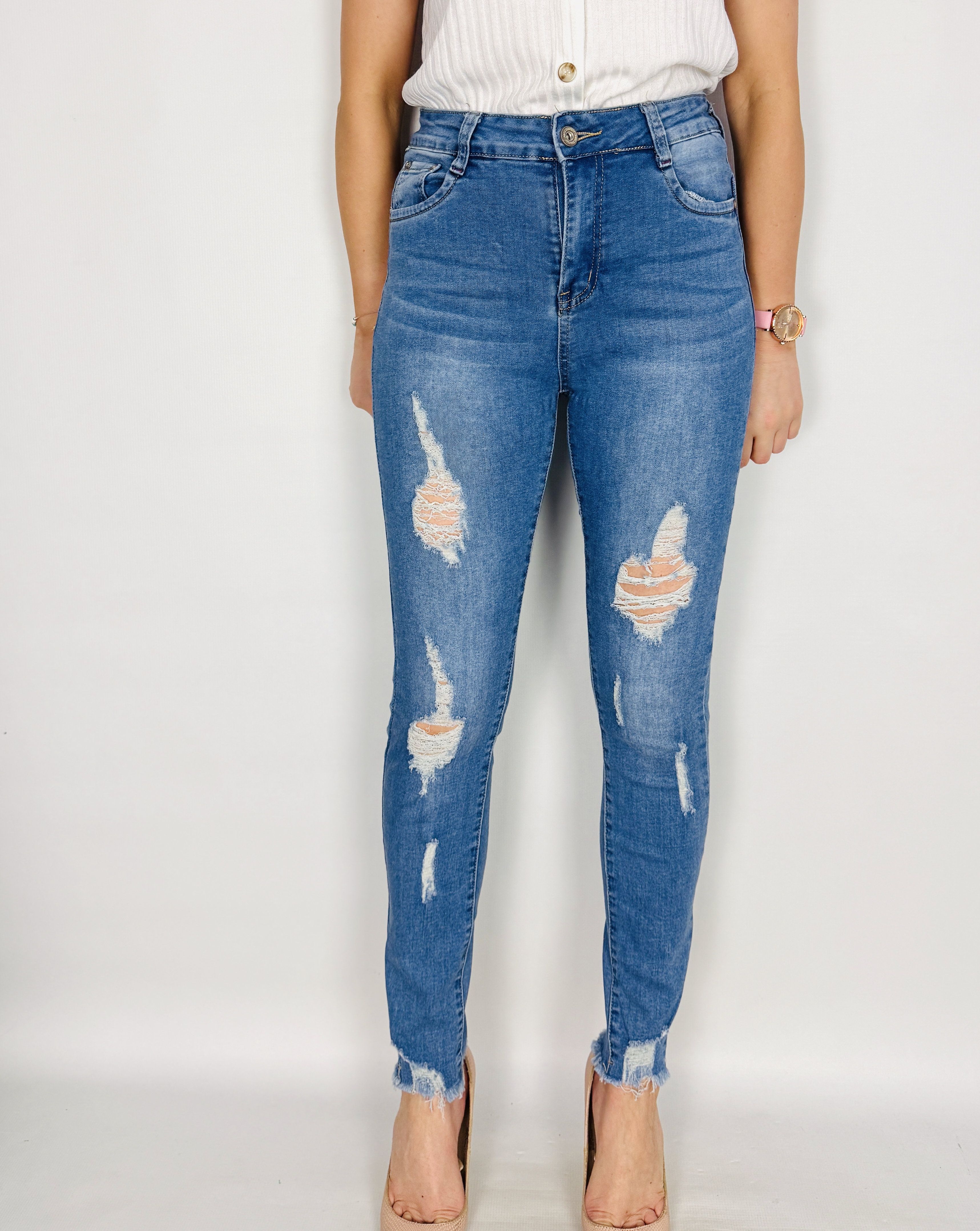 Jasnoniebieskie jeansowe spodnie rurki z przetarciami S 36