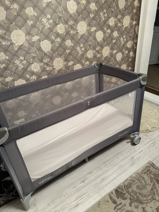 Дитяче ліжечко-манеж