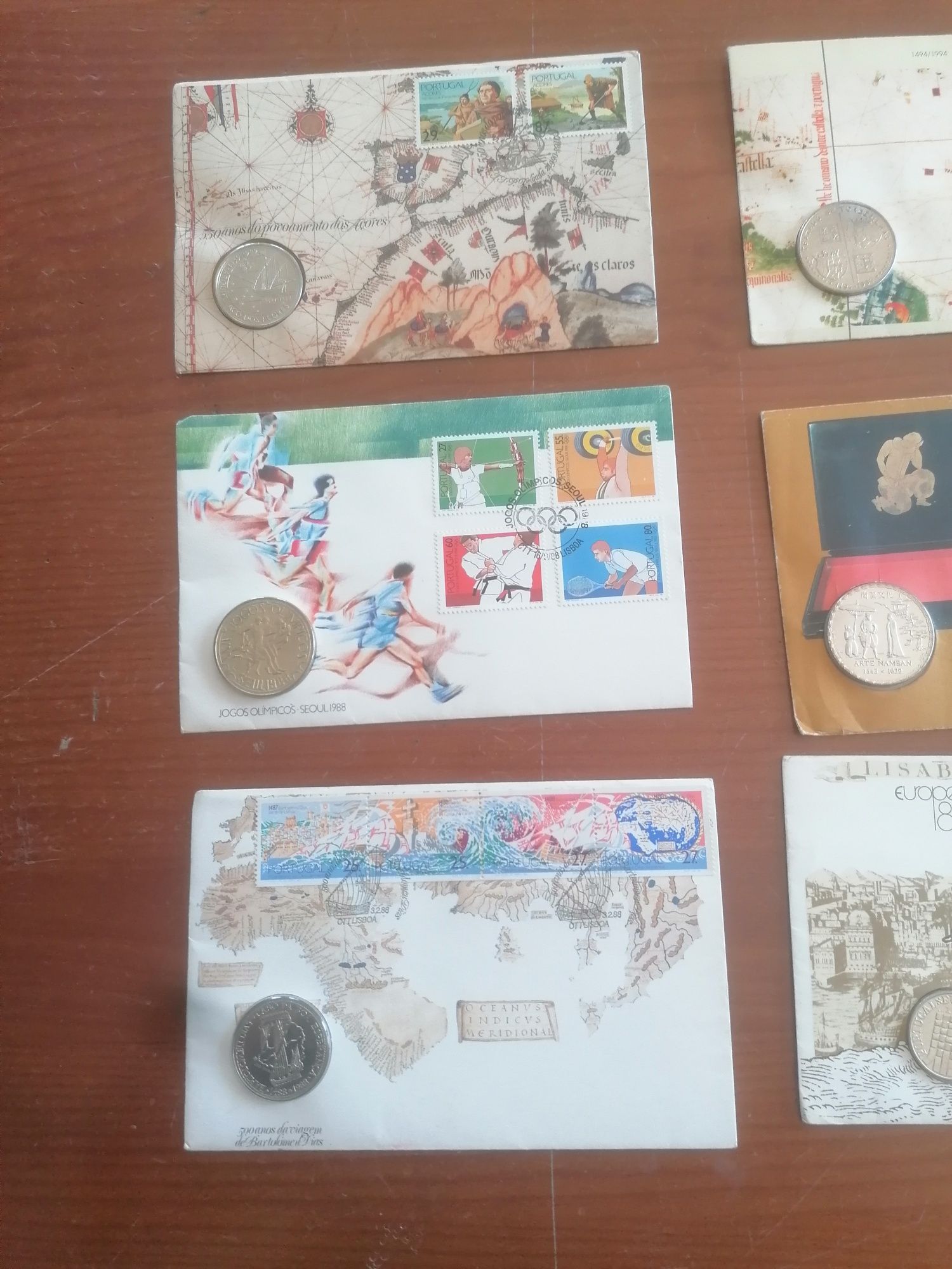 9 envelopes selados e com moedas novos e antigos