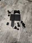 PlayStation 2, memory card 8MB, CD multijogos, comando Dualshock 2