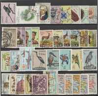 Angola - 77 selos novos e usados