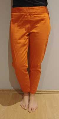 Wygodne spodnie pomarańczowe na lato