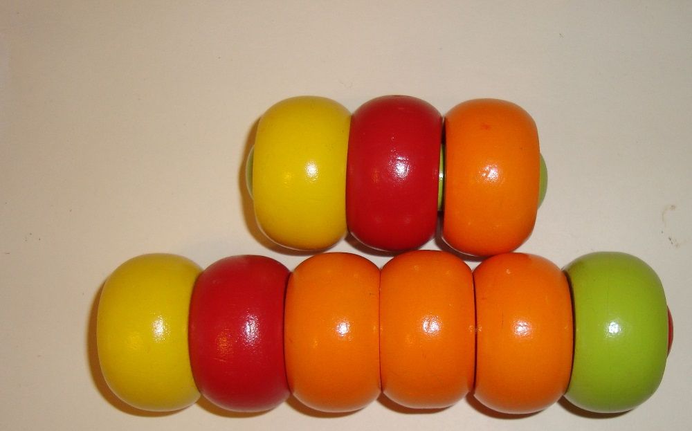 Игрушка деревянные палочки с колечками окрашенные