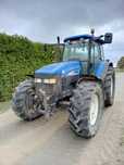New Holland TM 120 + z Tuzem