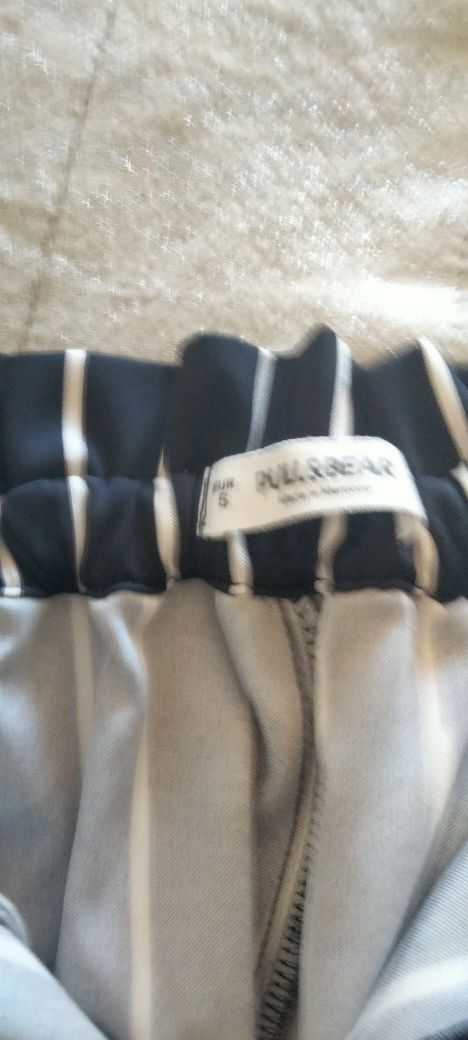 Calças tecido riscas Pull and bear