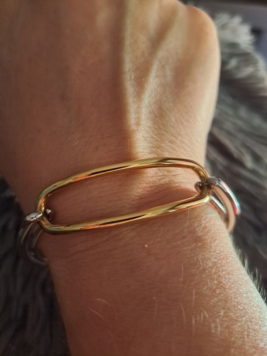 Pulseira em aço prateado e dourado