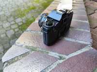 Aparat fotograficzny analogowy Canon. A-1 z obiektywem
