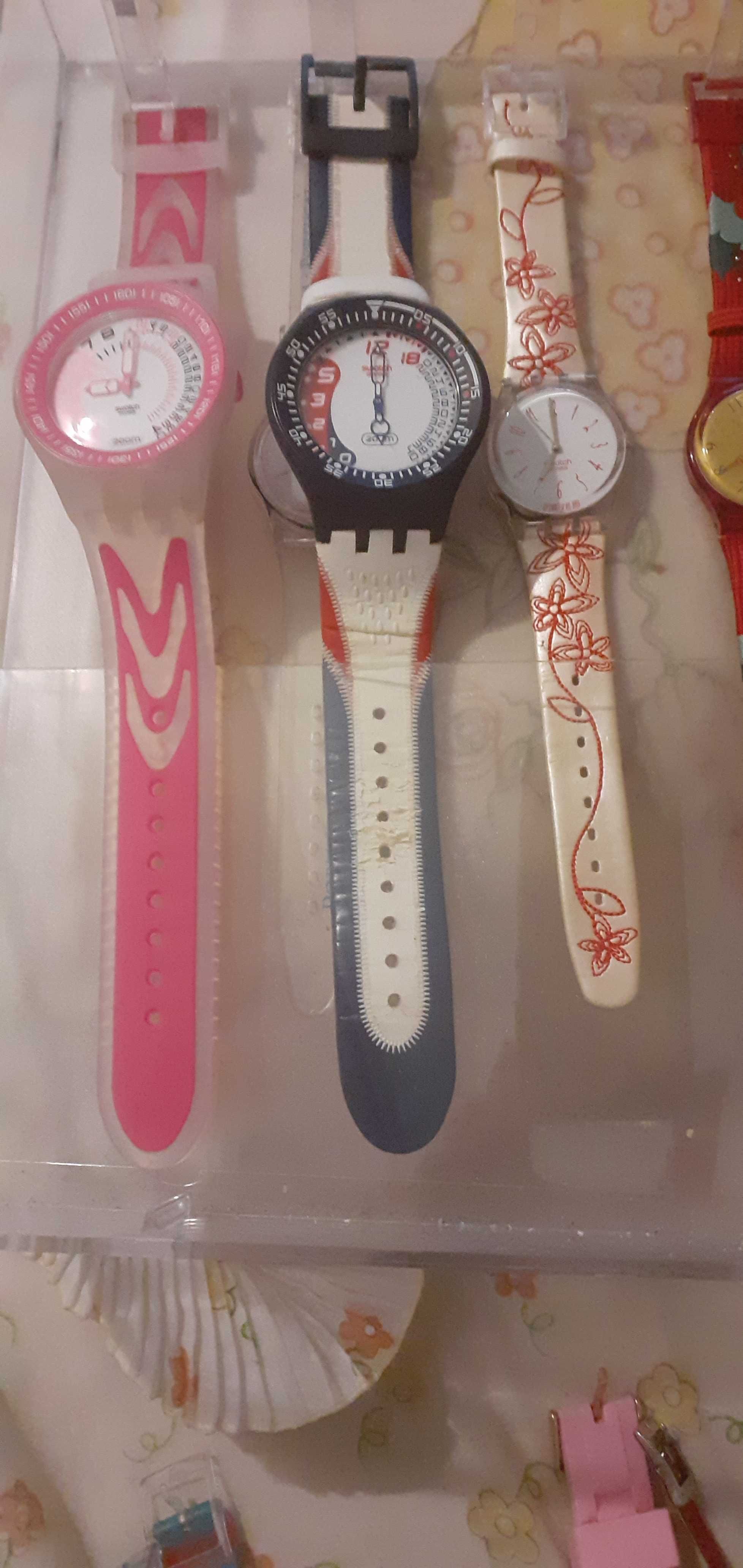 Relogios swatch em caixa da marca de exposicao