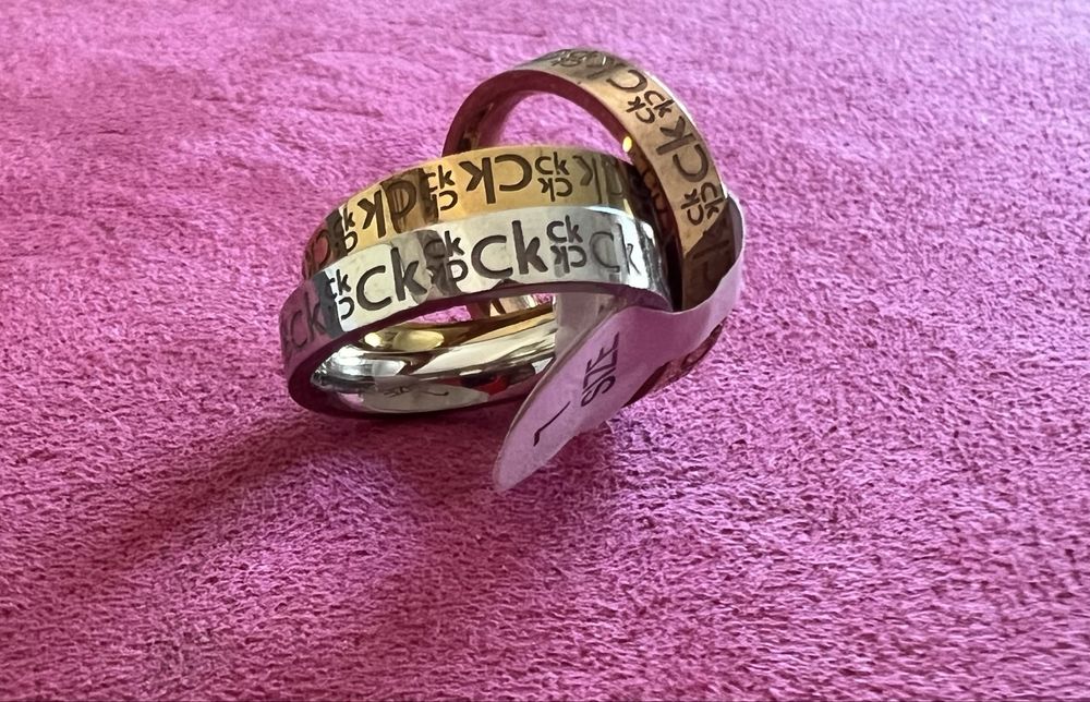 Três aliancas em aço inoxidável