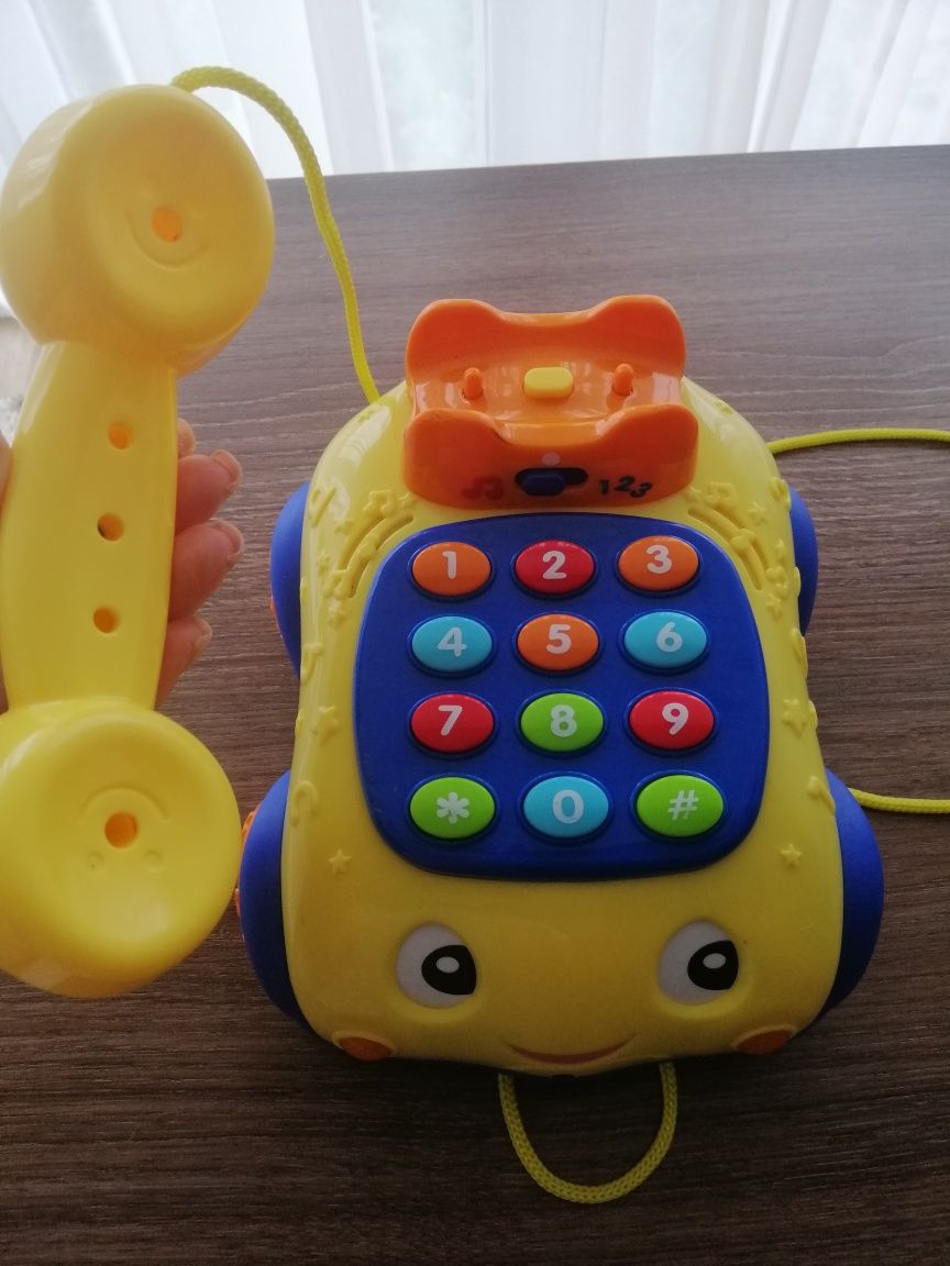 Детский телефон. Каталка телефон, на шнурке, музыка, звук, свет
