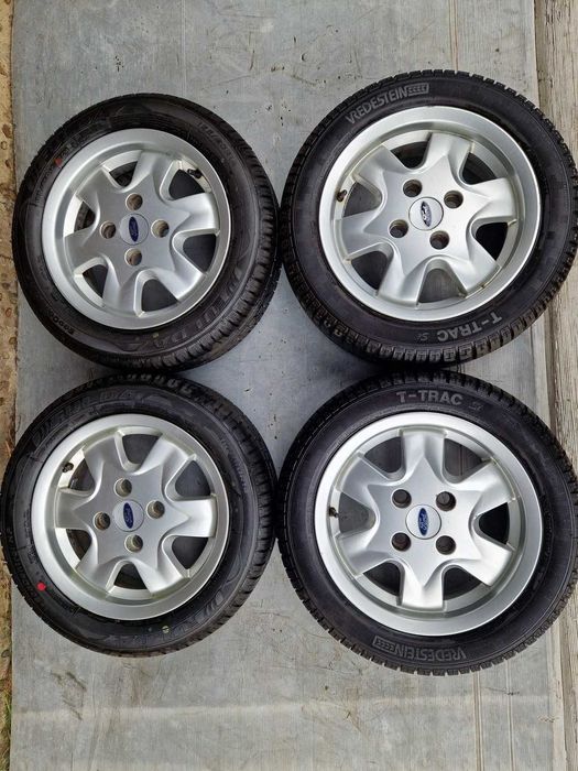 Koła Felgi OEM Ford 4x108 14x5j ET36 Opony 165/60/14 Wysoki Bieżnik