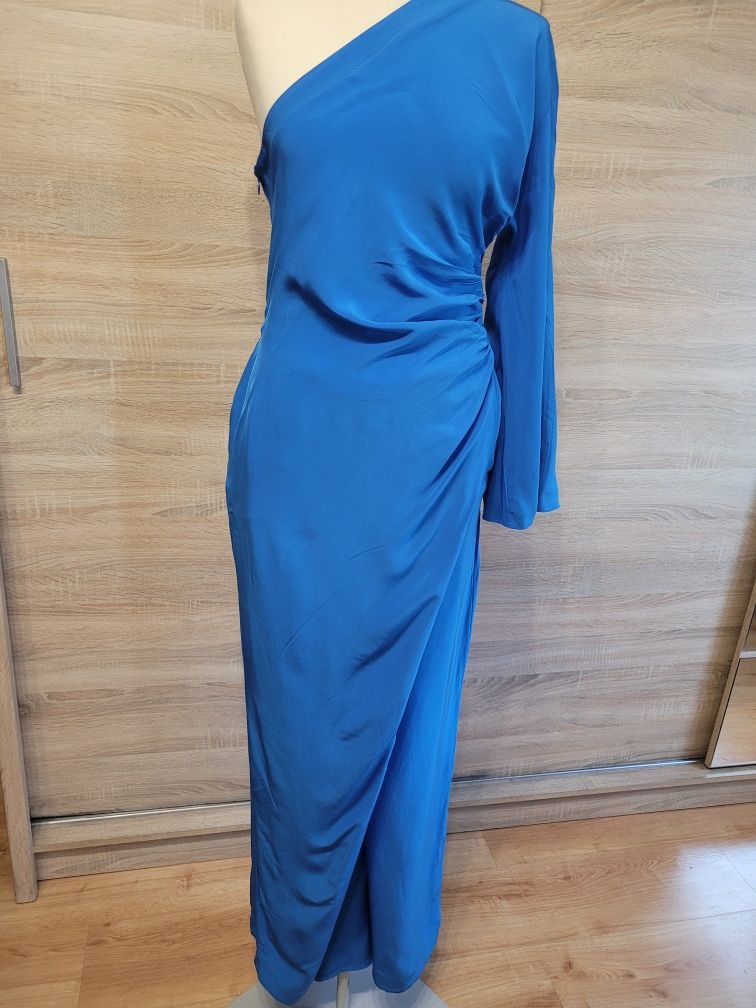 Elegancki kombinezon damski z szerokimi nogawkami