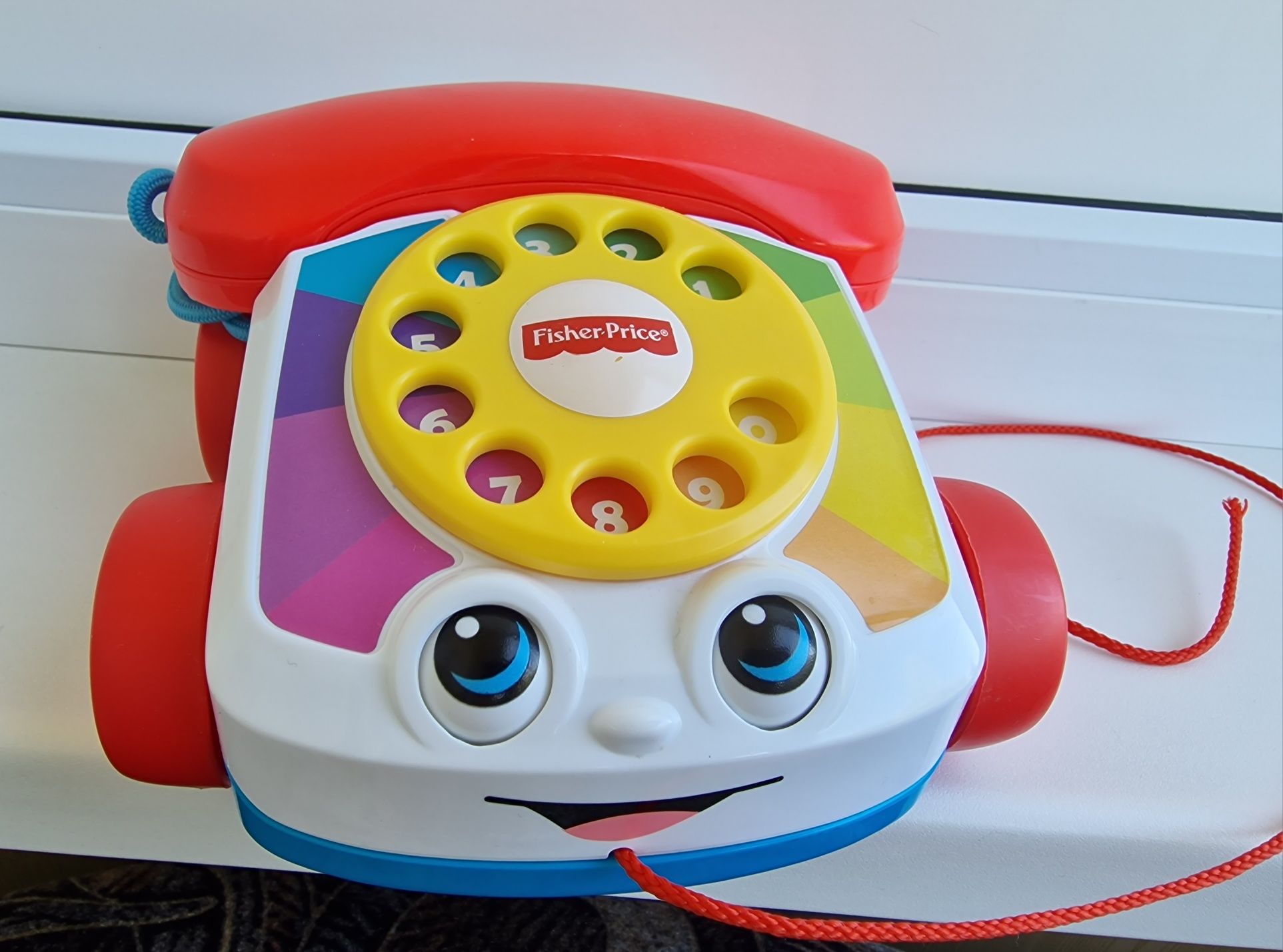 Fisher price телефон каталка