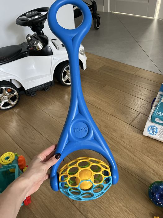 Іграшка - каталка з брязкальцем Toys