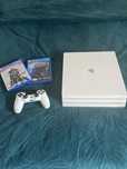 Konsola Ps4 Pro biała + Pad + 2 Gry