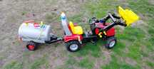 Traktor Rolly Toys z + cysterna z rozpylaczem + koparka+ akcesoria