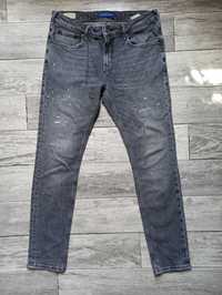 Spodnie jeansowe rurki z przetarciami skim Scotch & Soda